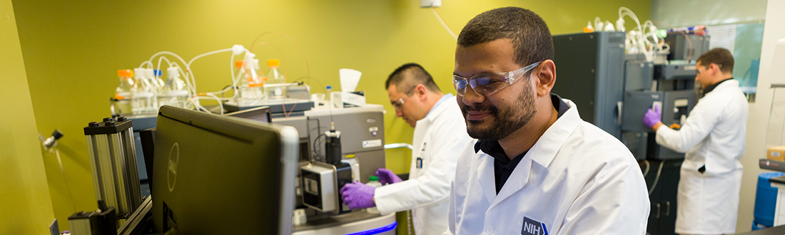Male lab technician in the lab viewing equipmemt.