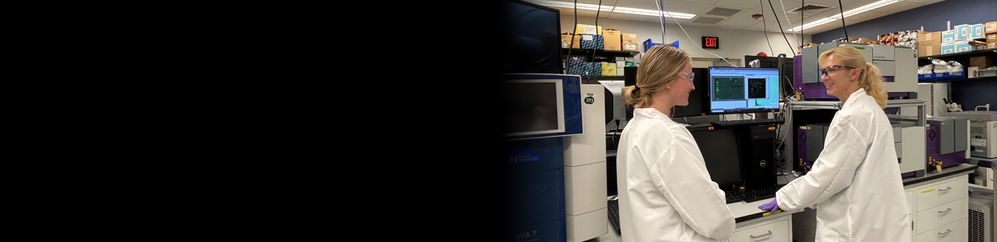 Two NCATS scientists in the lab